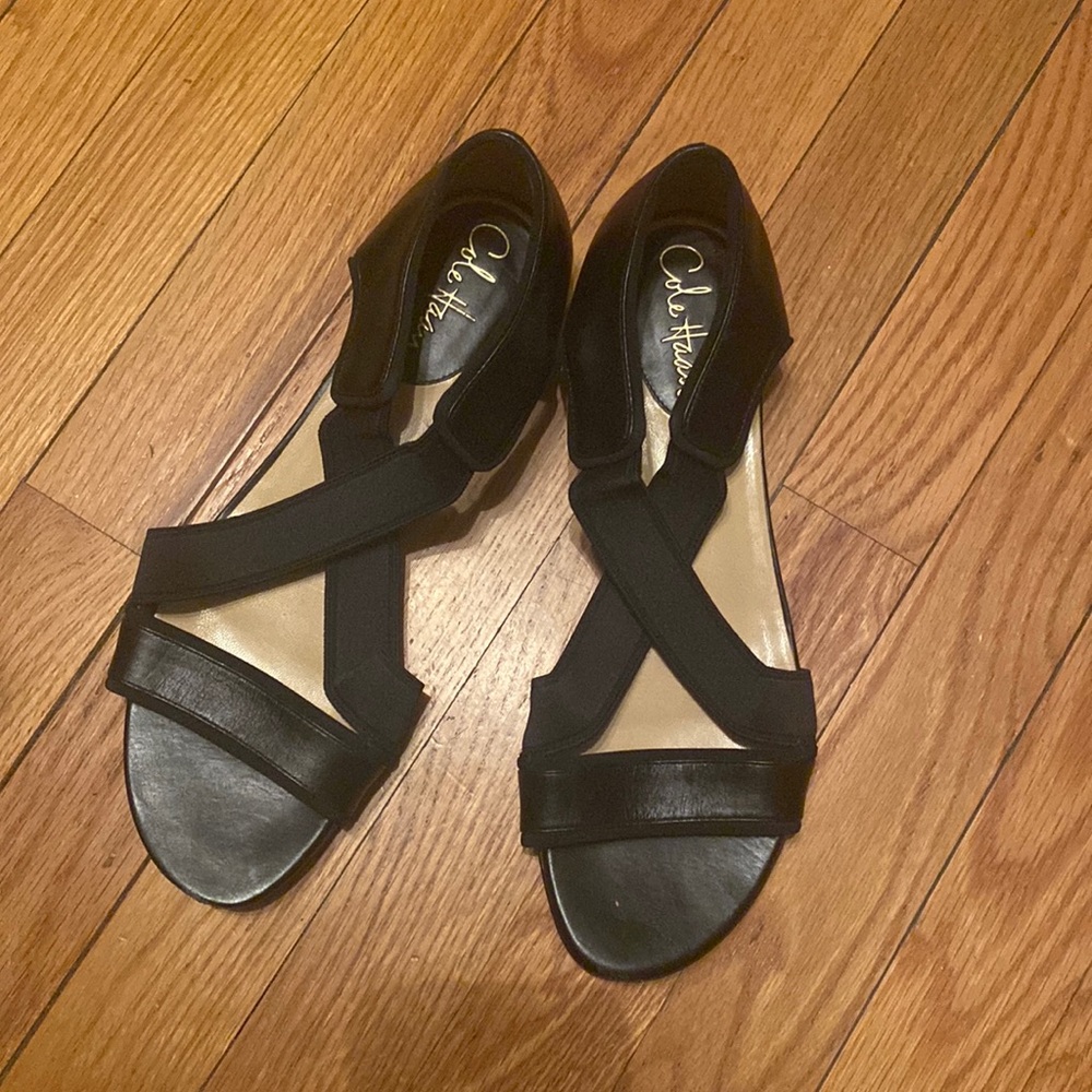 Cole Haan sandals. Black leather with synthetic stretchy crisscrossed straps.